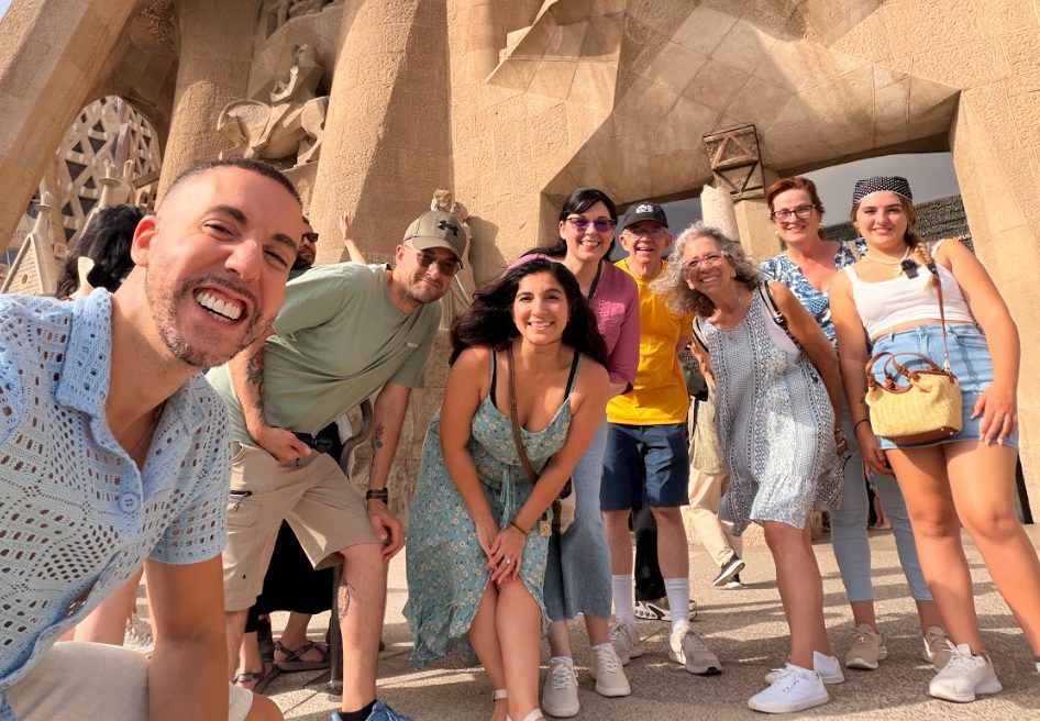 Group of travelers sightseeing together at a historic landmark